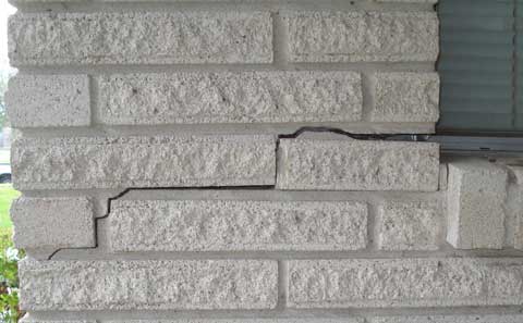 Movement of the clay soils underneath the concrete slab will produce this type of damage.